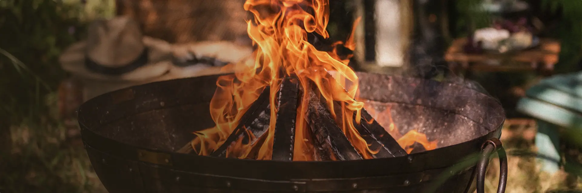 kadai Fire pit with flames in an outdoor setting