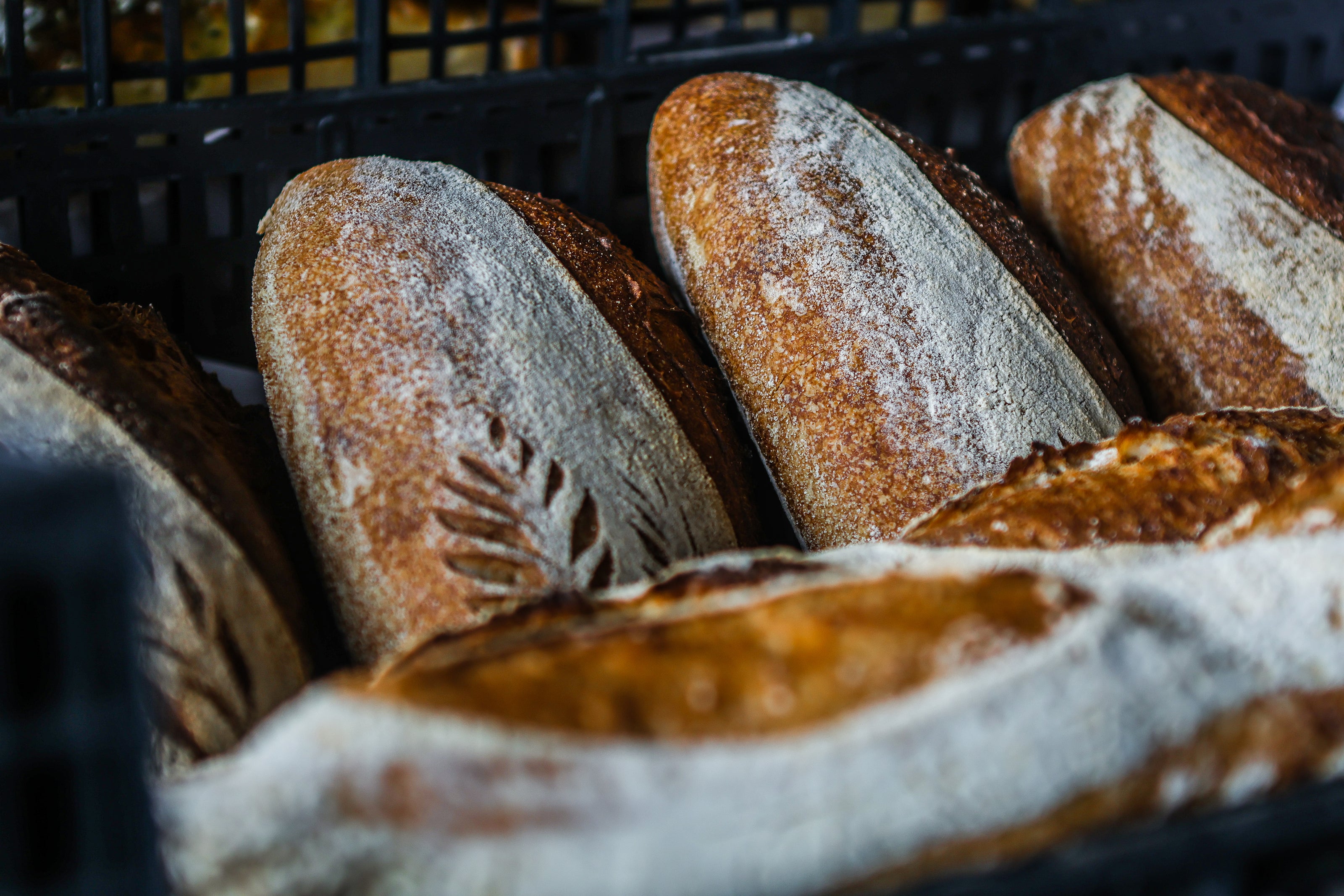 Loaves of bread in a basket with a rustic appearance