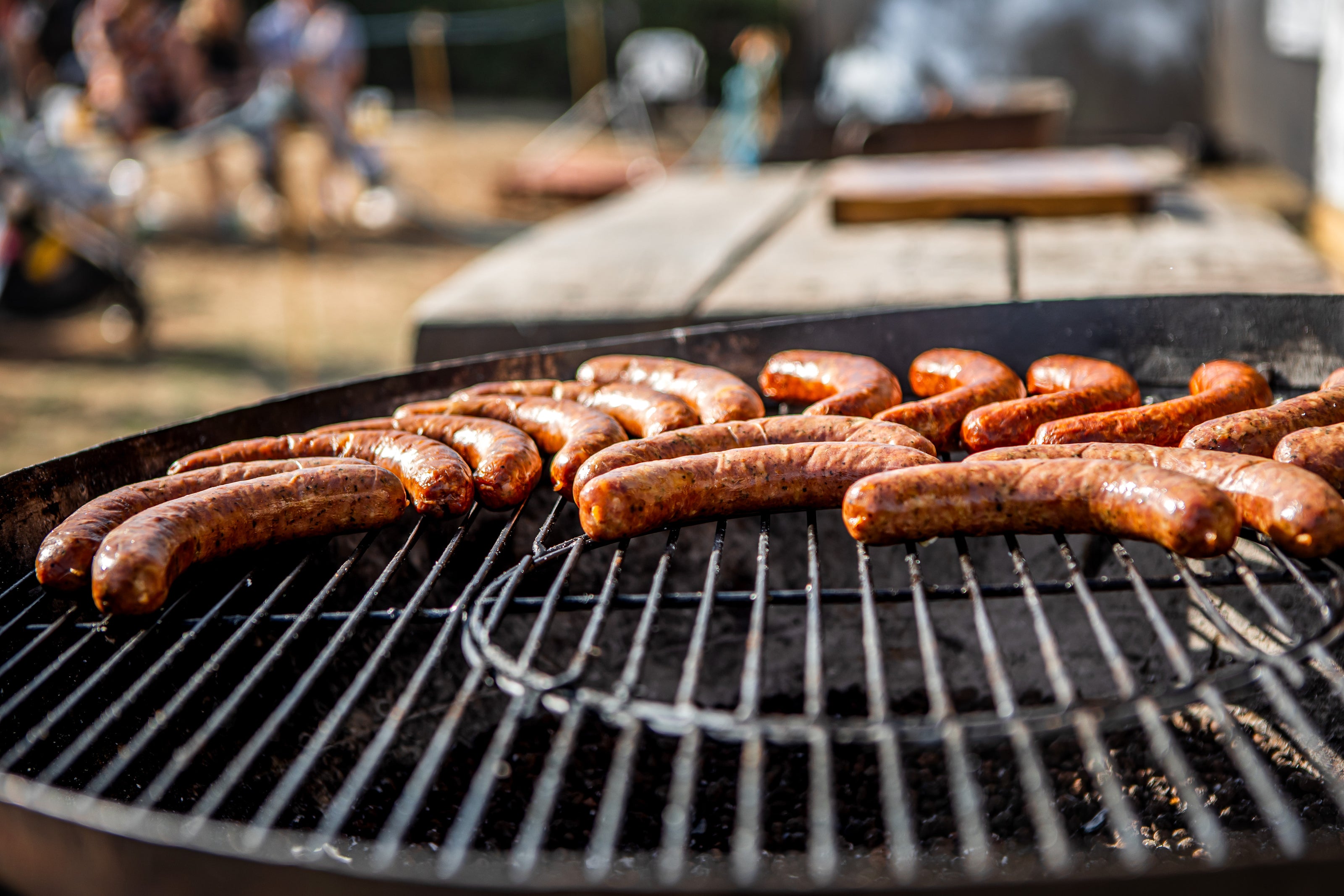 Grill with sausages cooking on a sunny day on a Kadai