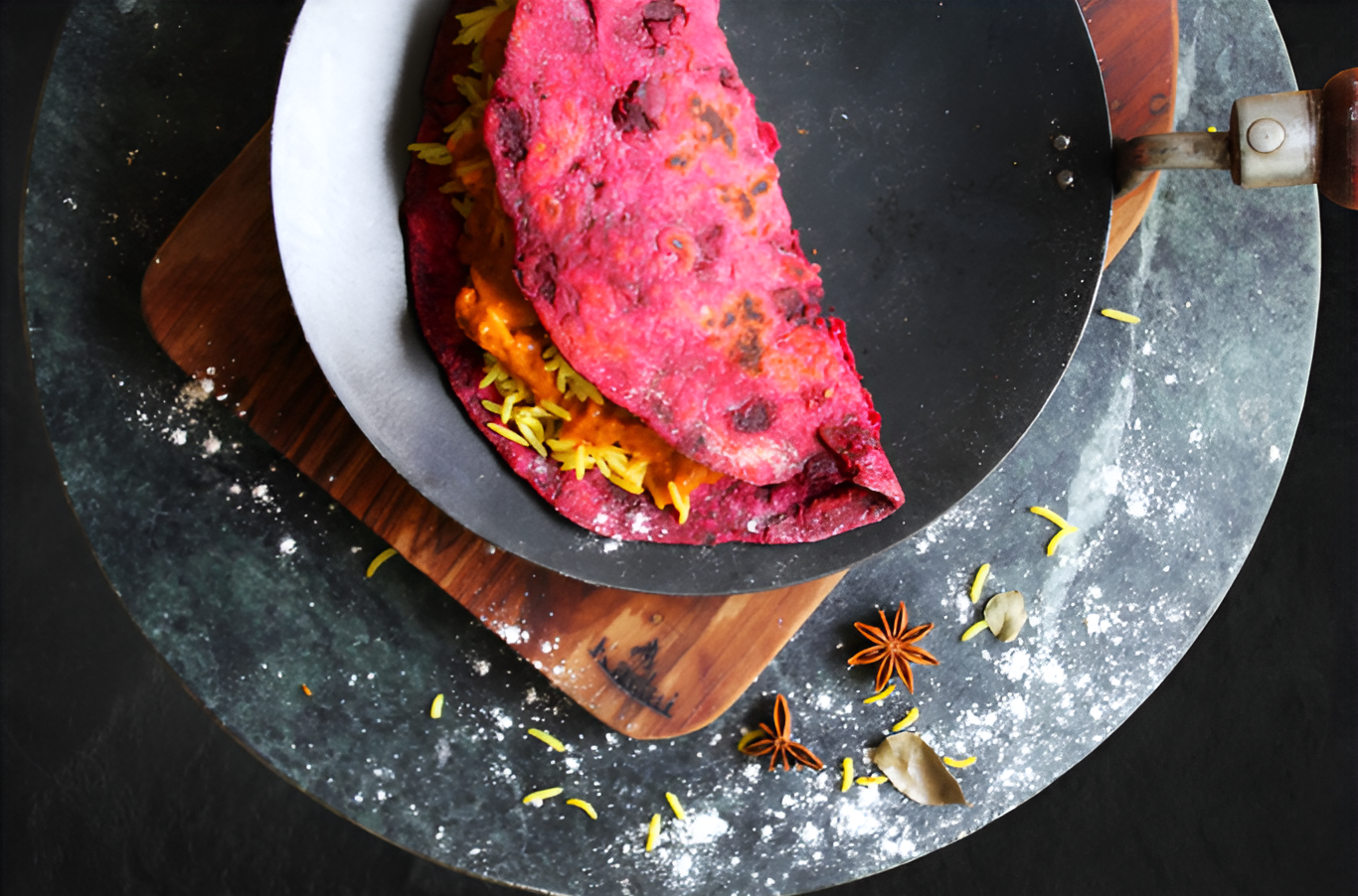 Pink Beetroot Chapati on a pan and a wooden board