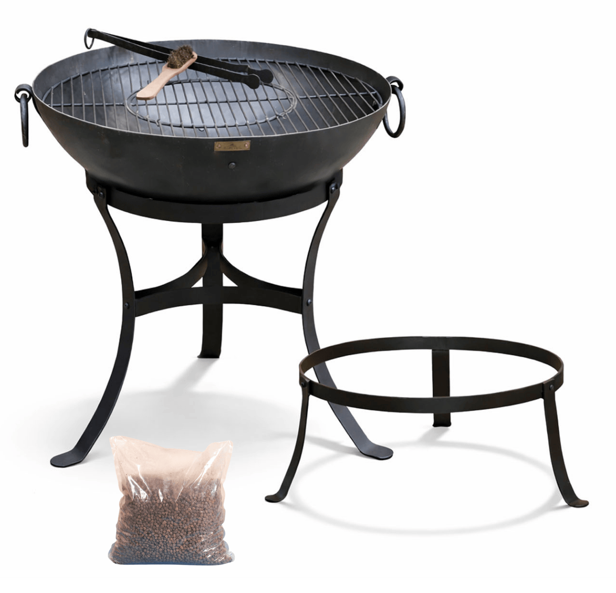Classic metal fire pit with grill grate and on a white background