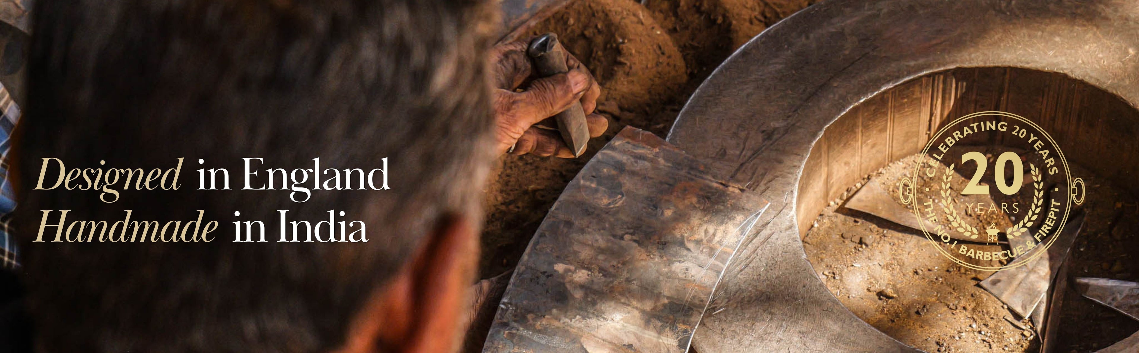 A man in a workshop handcrafting a metal Kadai Fire Pit