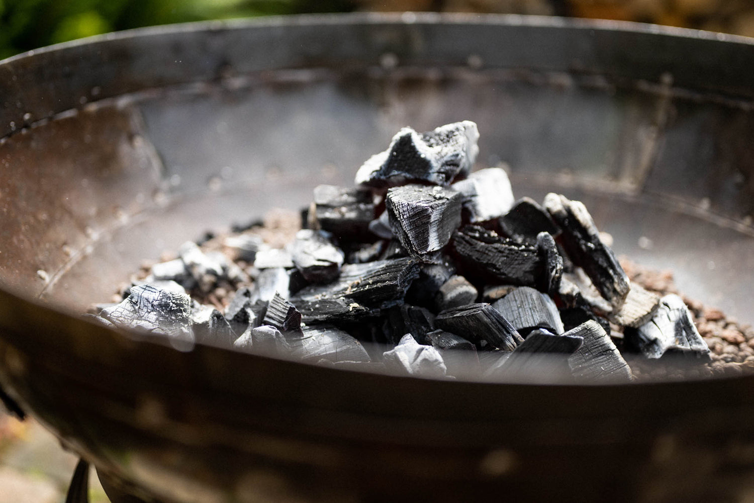 Hot charcoal in the bottom of the Kadai Firebowl for cooking