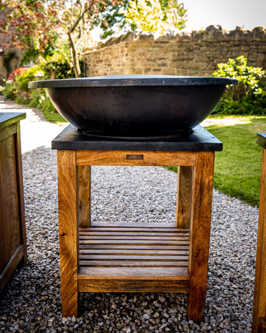 kadai plancha kadai with shield resting on bowl