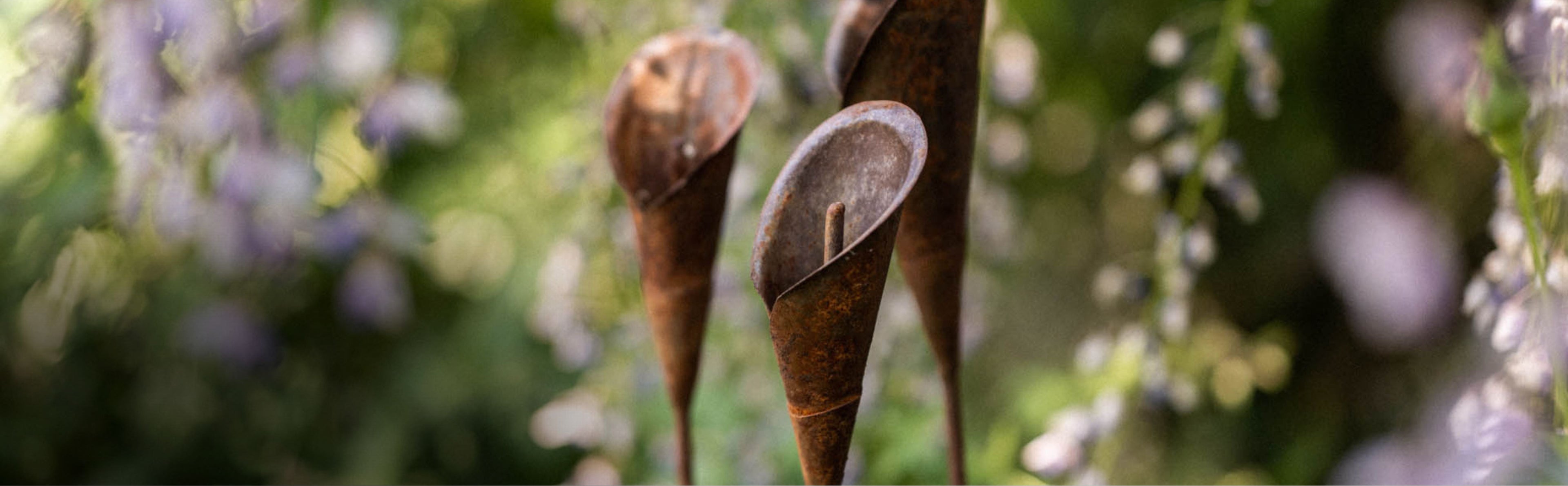 Close-up of plant sticks in a flower bed