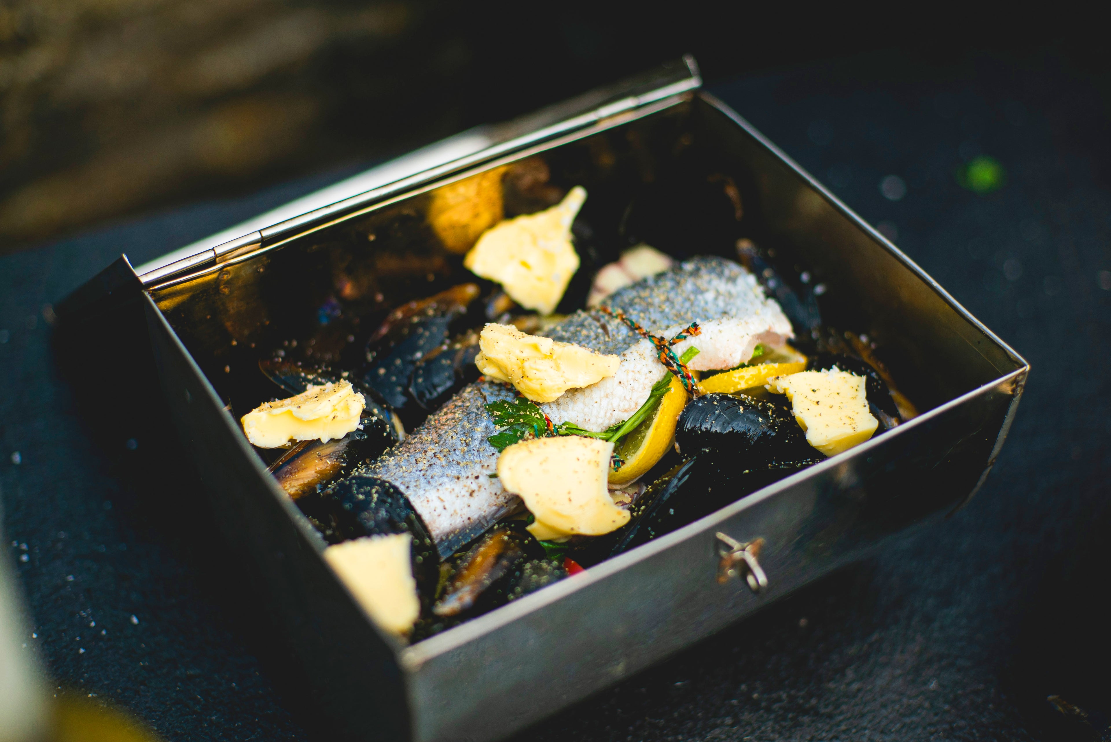 Grilled fish with vegetables in kadai roasting oven