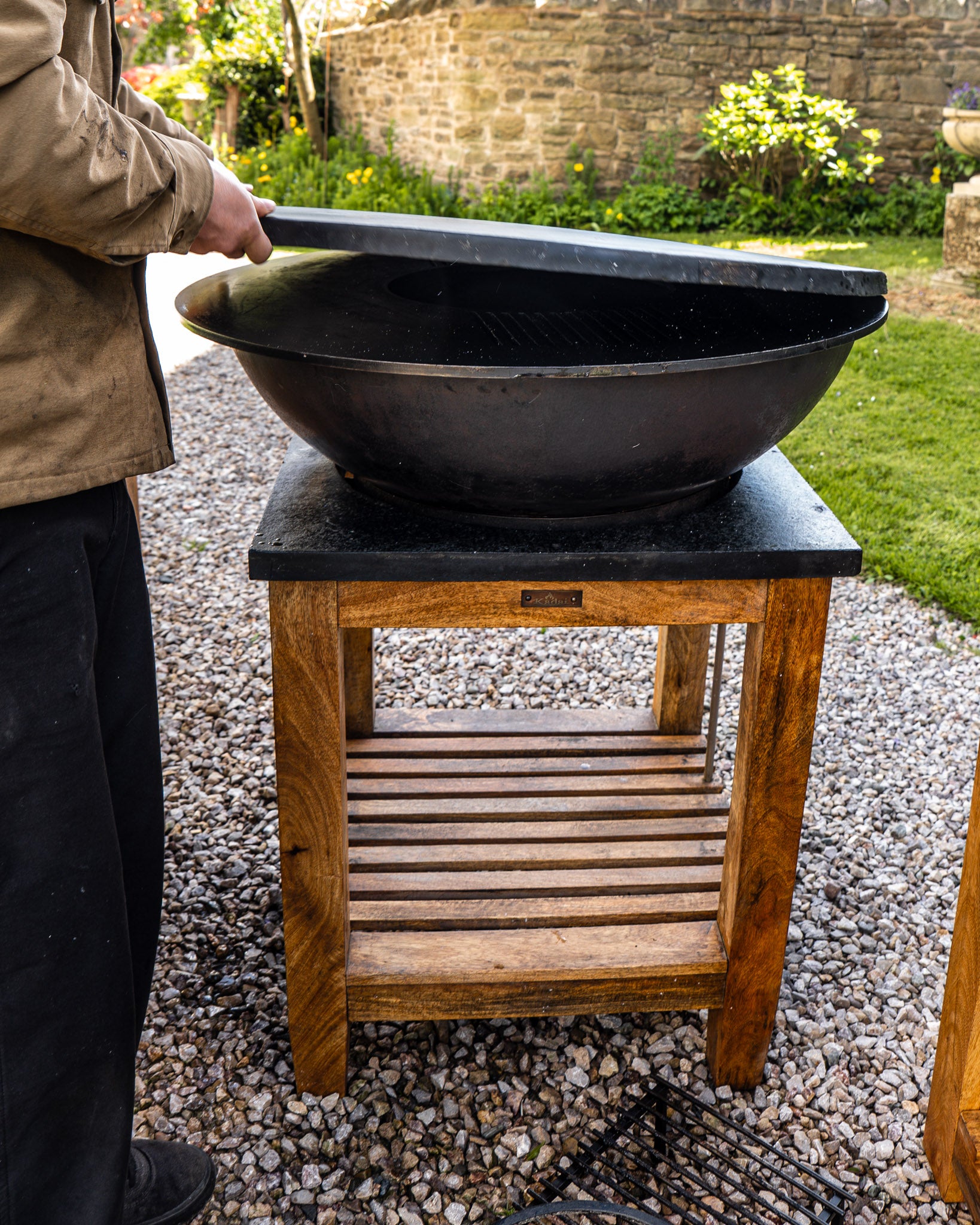 black plancha kadai shield being placed