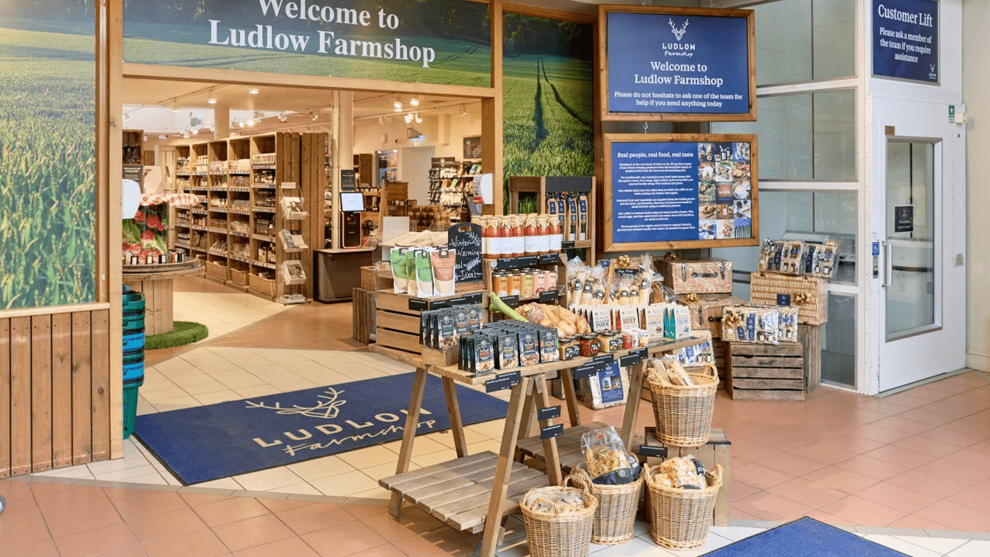 Ludlow Farmshop interior with product displays and signage.