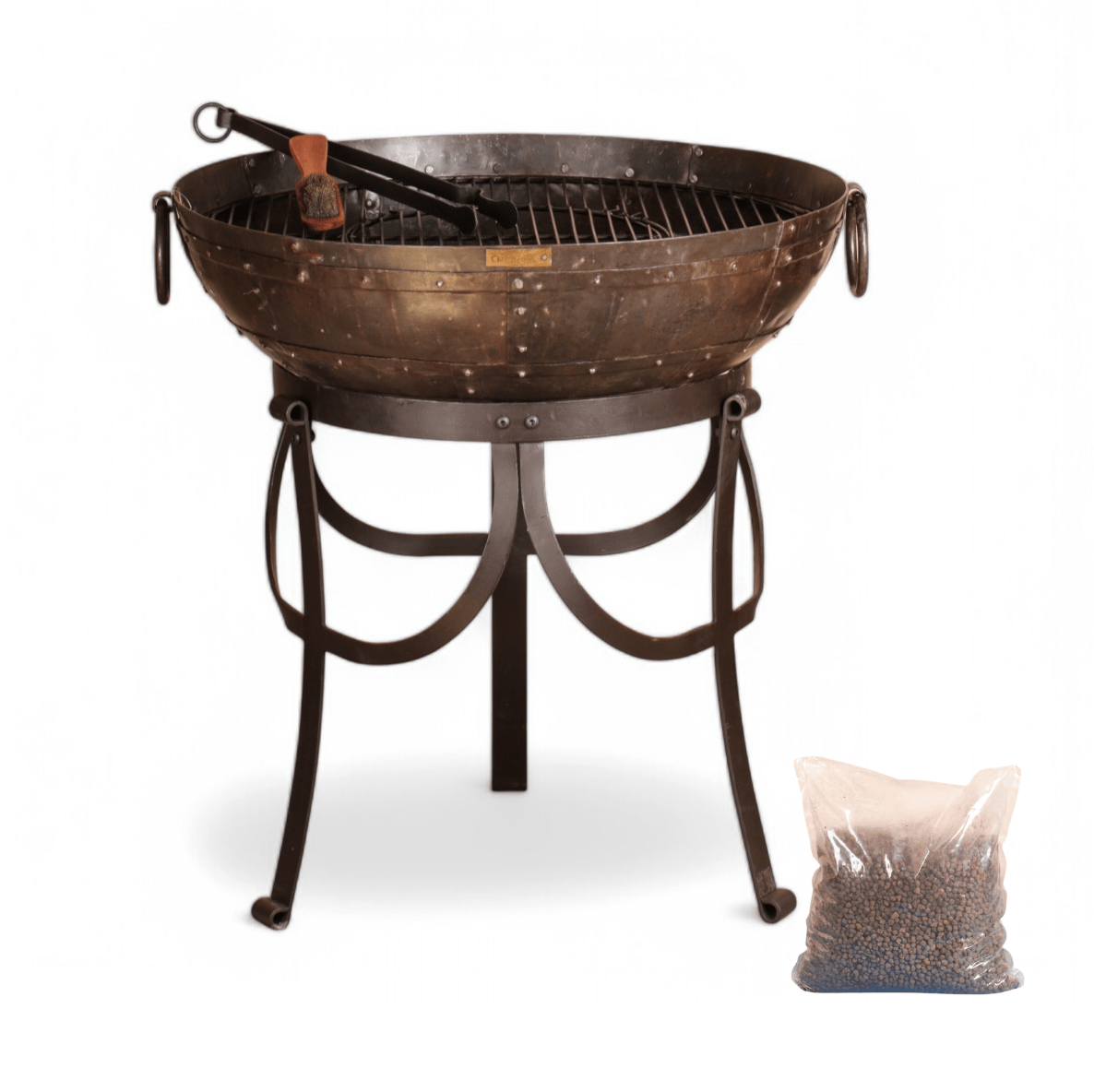 Metal outdoor fire pit with grill on a white background