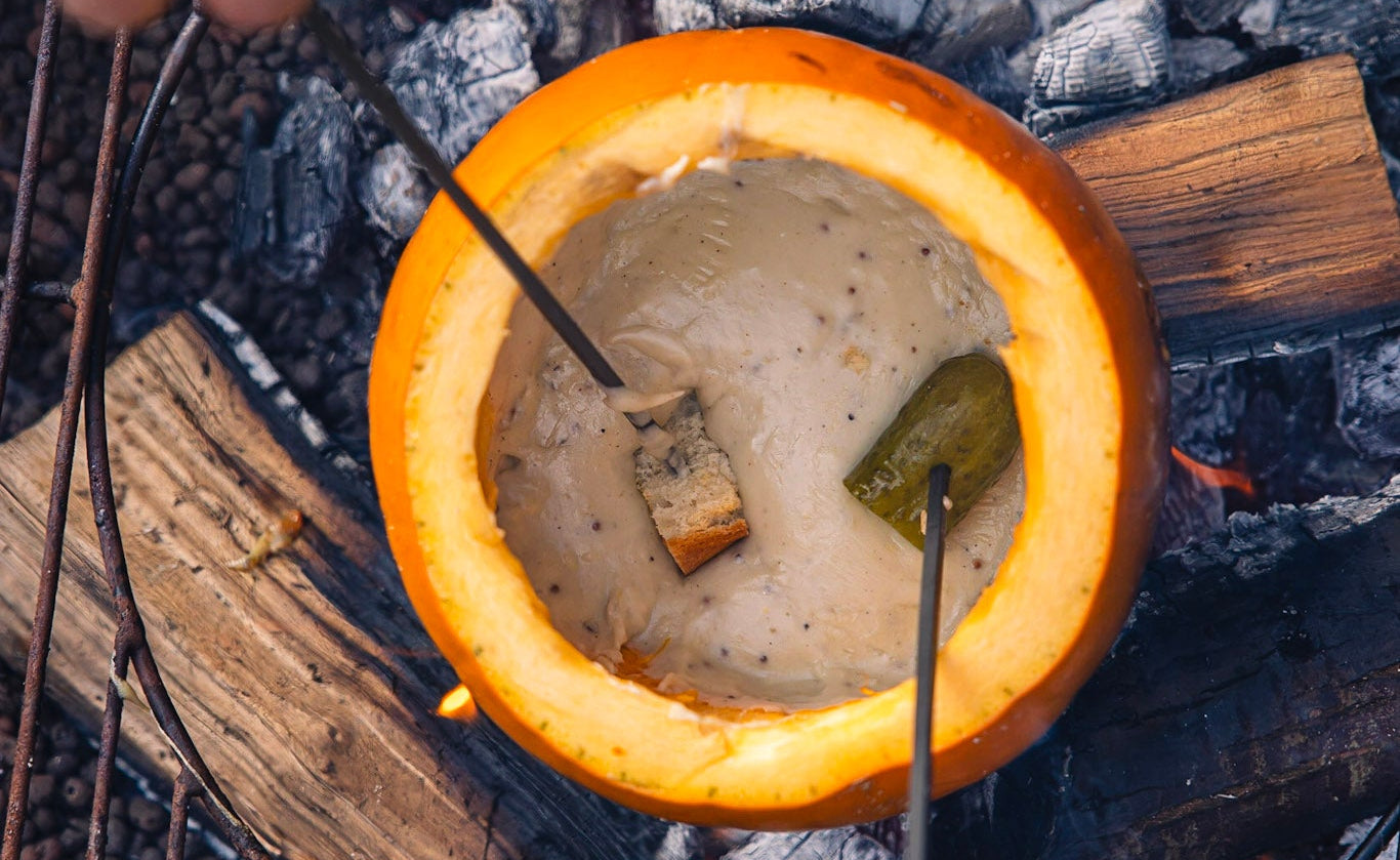 Pumpkin with bubbling cheese fondue inside