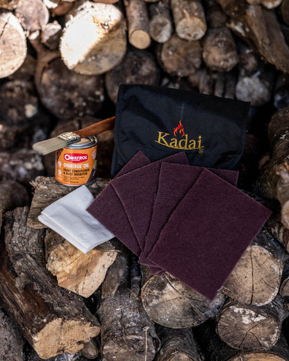 Outdoor fire pit maintenance kit featuring Kadai cleaning accessories and protective treatment supplies for metal cookware and fire bowls