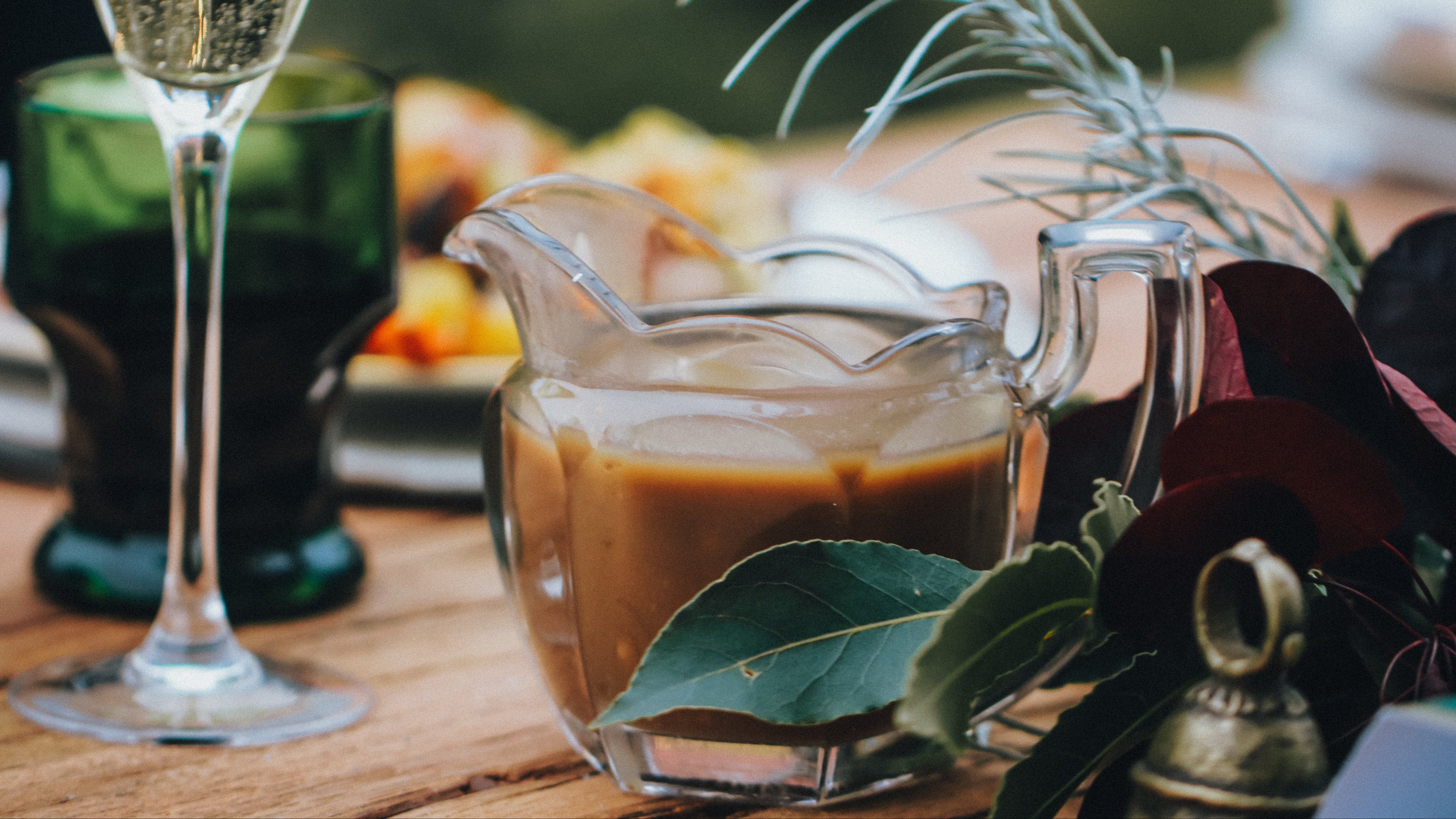 jug of gravy on a decorative table.