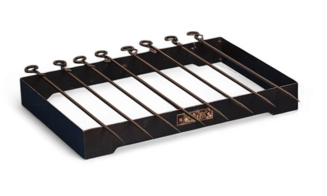 Black metal grill rack on a white background