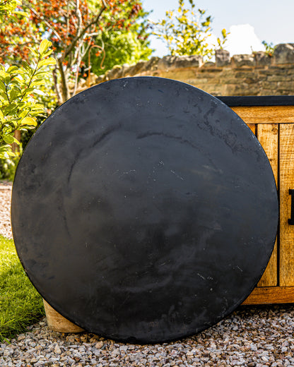 kadai plancha shield resting against cupboard