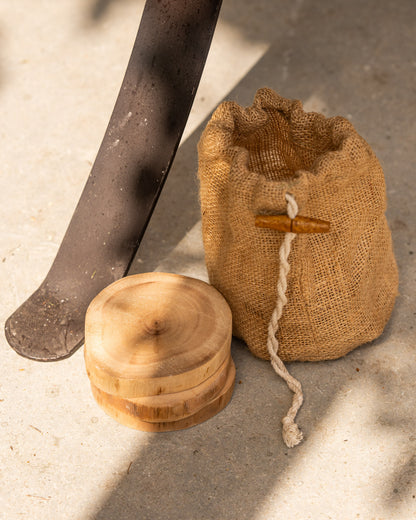 Handcrafted wooden feet for Kadai fire pits, supplied with a natural storage pouch to help protect patios, decking and outdoor surfaces from heat and marking