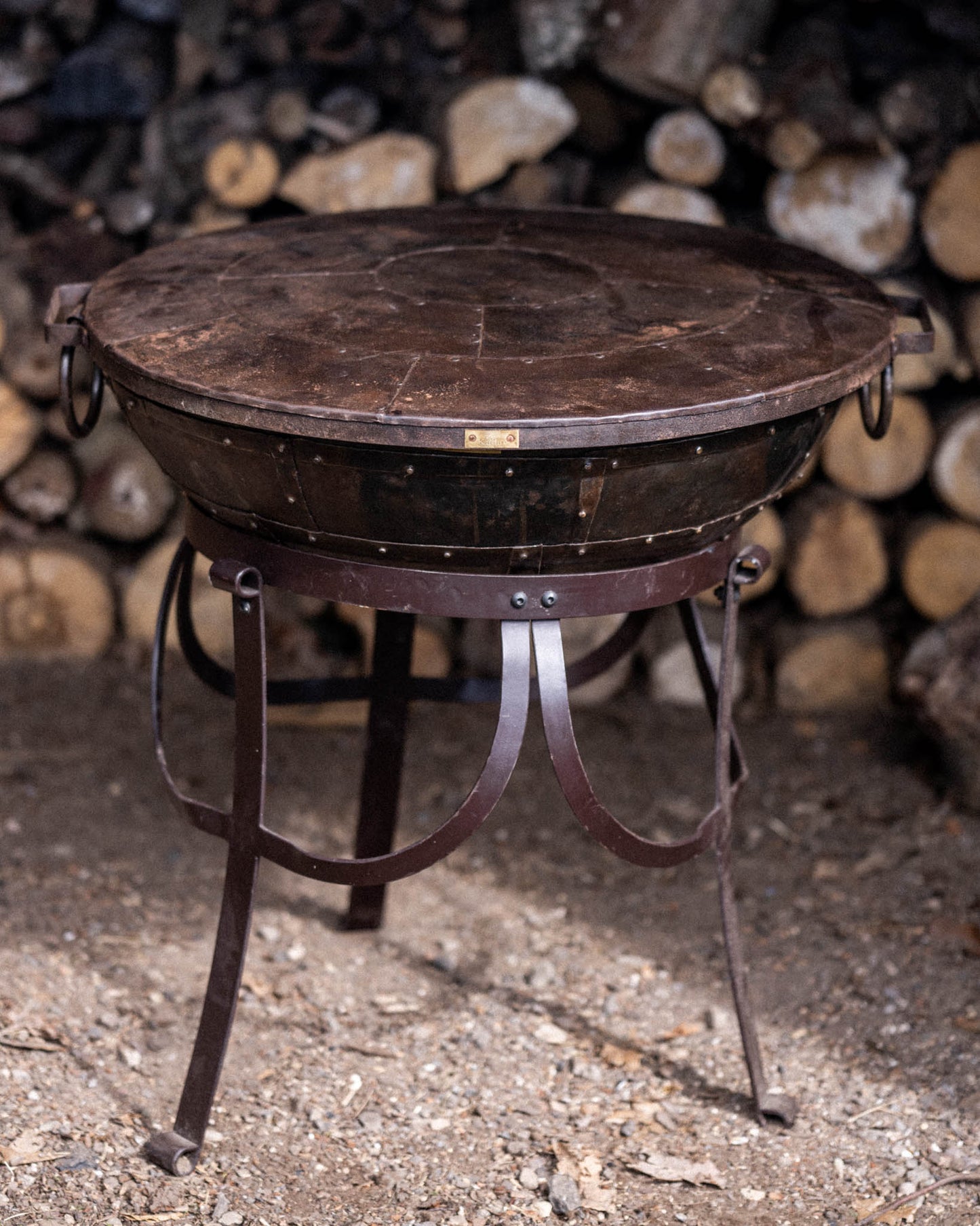 Kadai fire bowl with fitted metal lid.