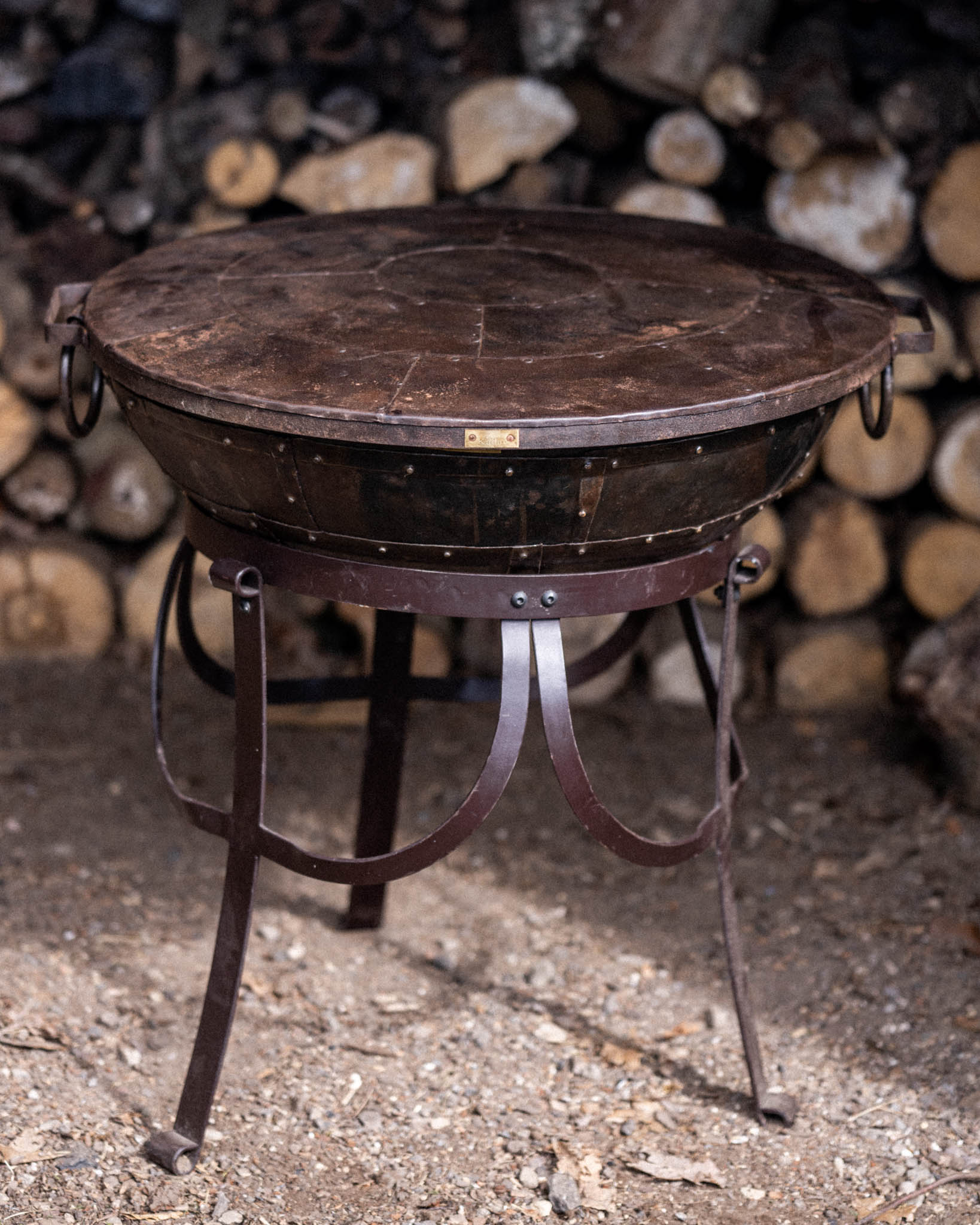 Kadai fire bowl with fitted metal lid.