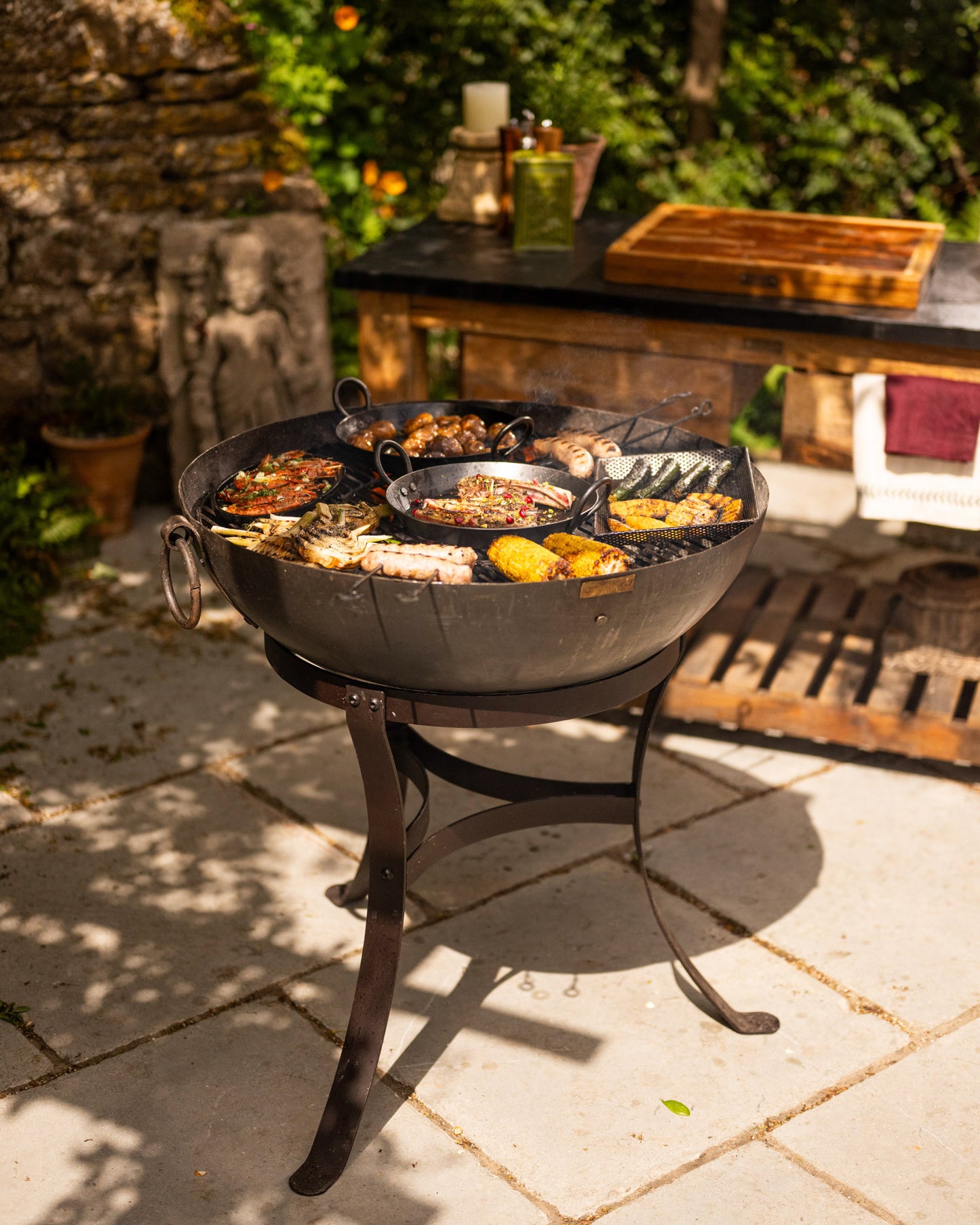 Outdoor BBQ grill with food on a patio.