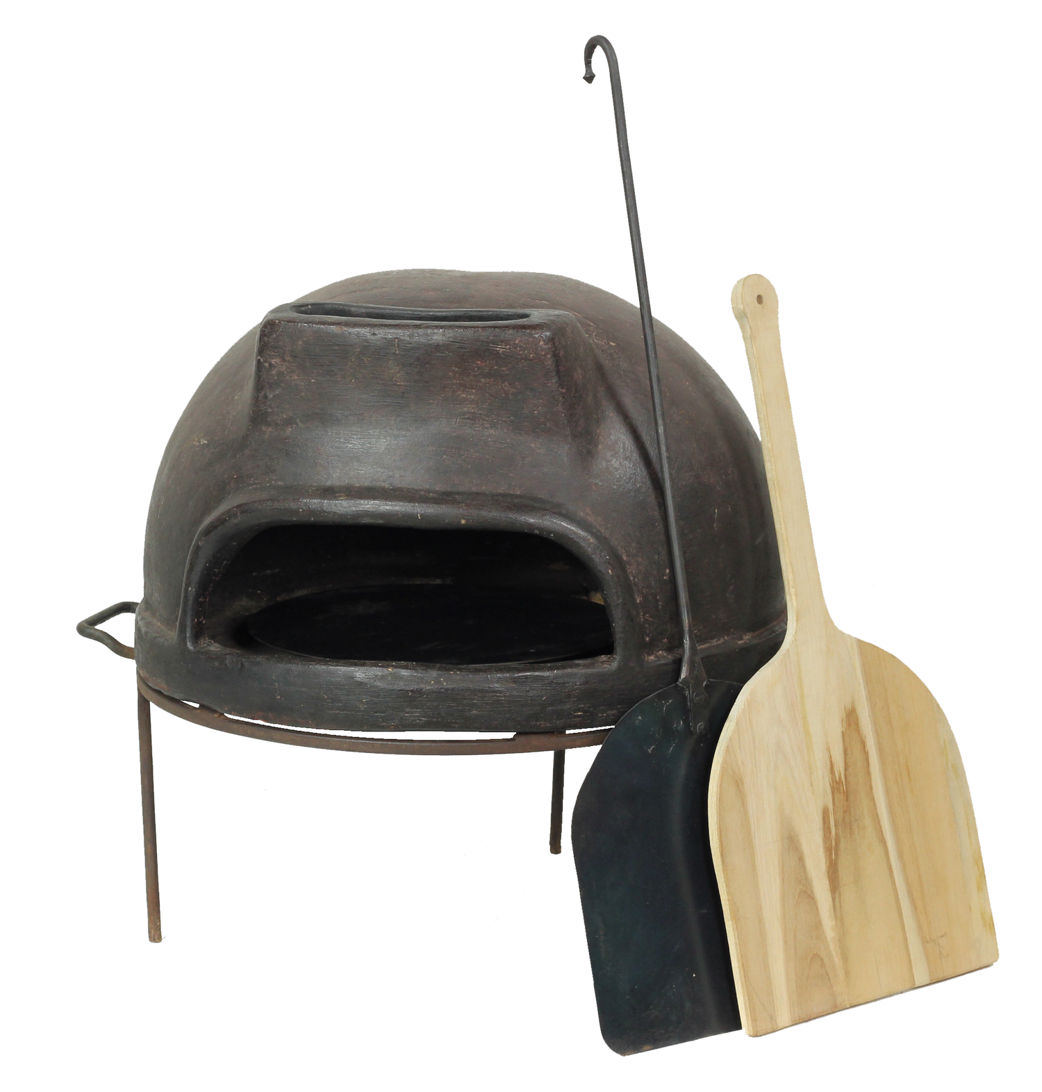 Outdoor pizza oven with a wooden peel and black shovel on a white background